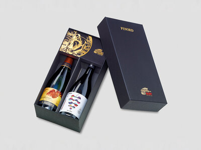Caja regalo Bodegas Pinord a domicilio: botella de vino tinto, cava y chocolates artesanos